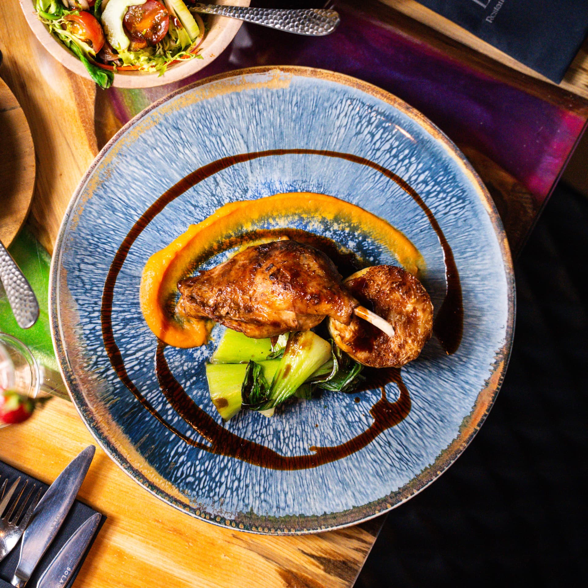 Confit duck leg with bok choy and butternut purée